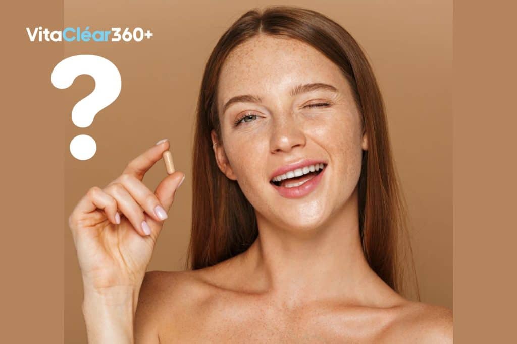 בחורה אוחזת ביד כמוסת ויטמינים של ויטה קליר 360+ לחיזוק ציפורניים חלשות וסדוקות
